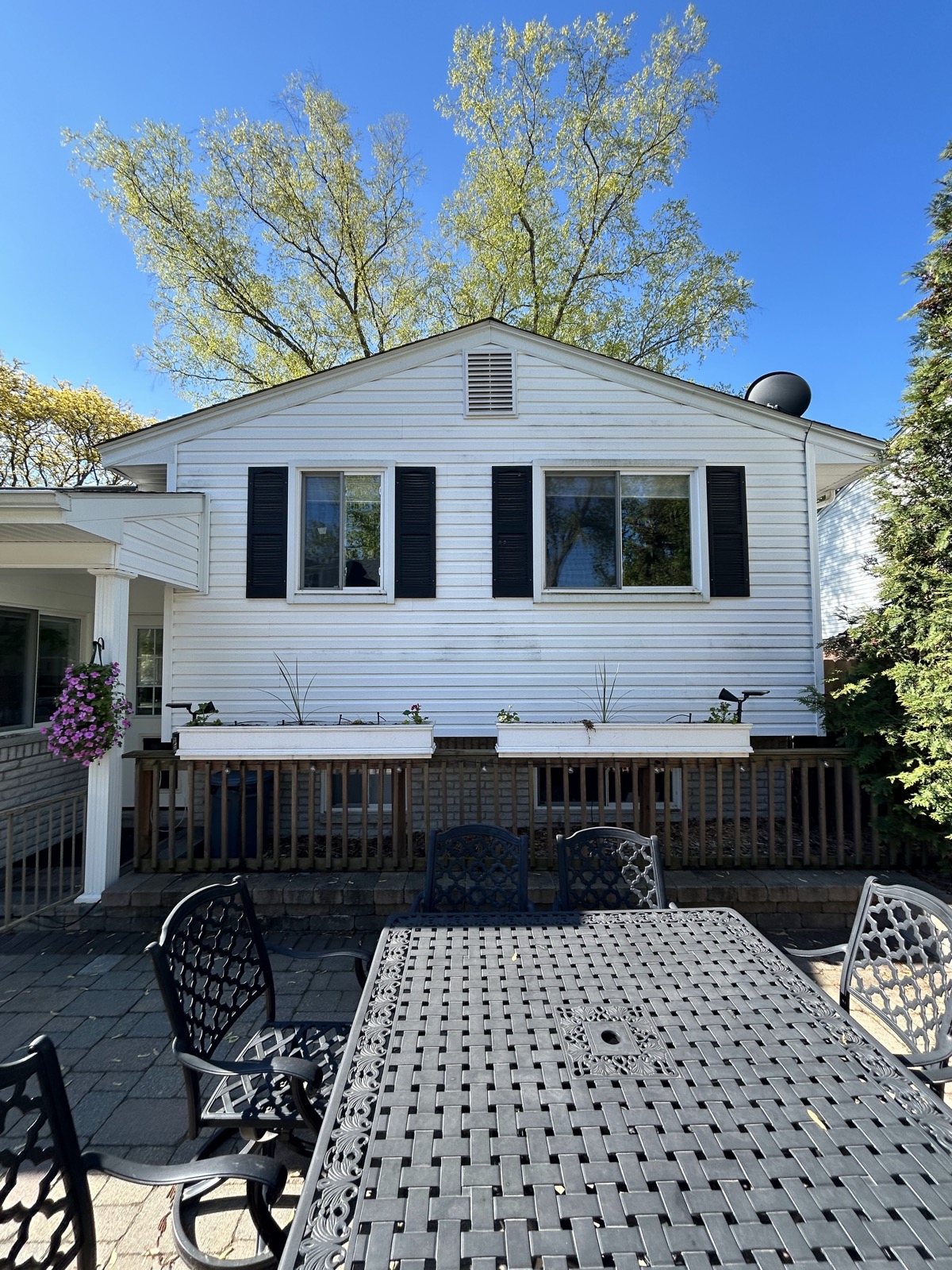Clean rear windows and patio doors on a two-story home in metro Detroit
